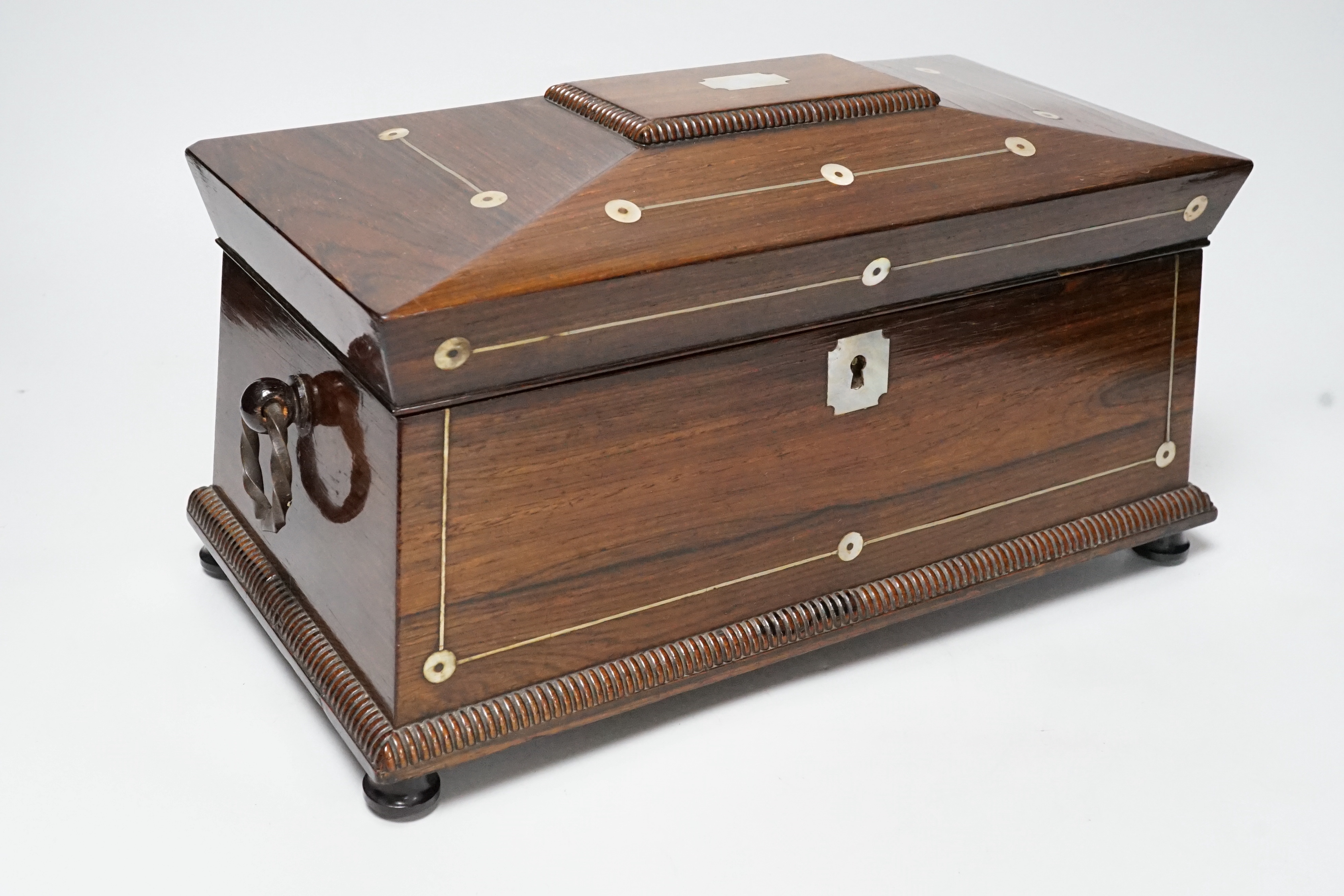 A William IV mother of pearl inlaid rosewood tea caddy, 31cm wide